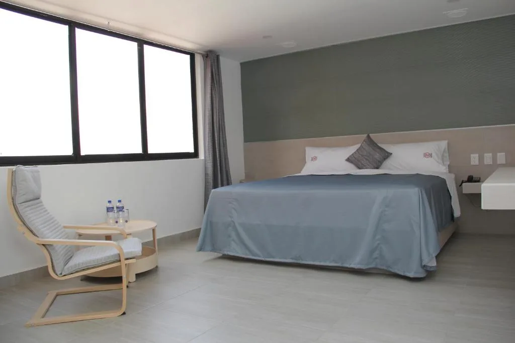 Habitación con cama King en Hotel Parador Real